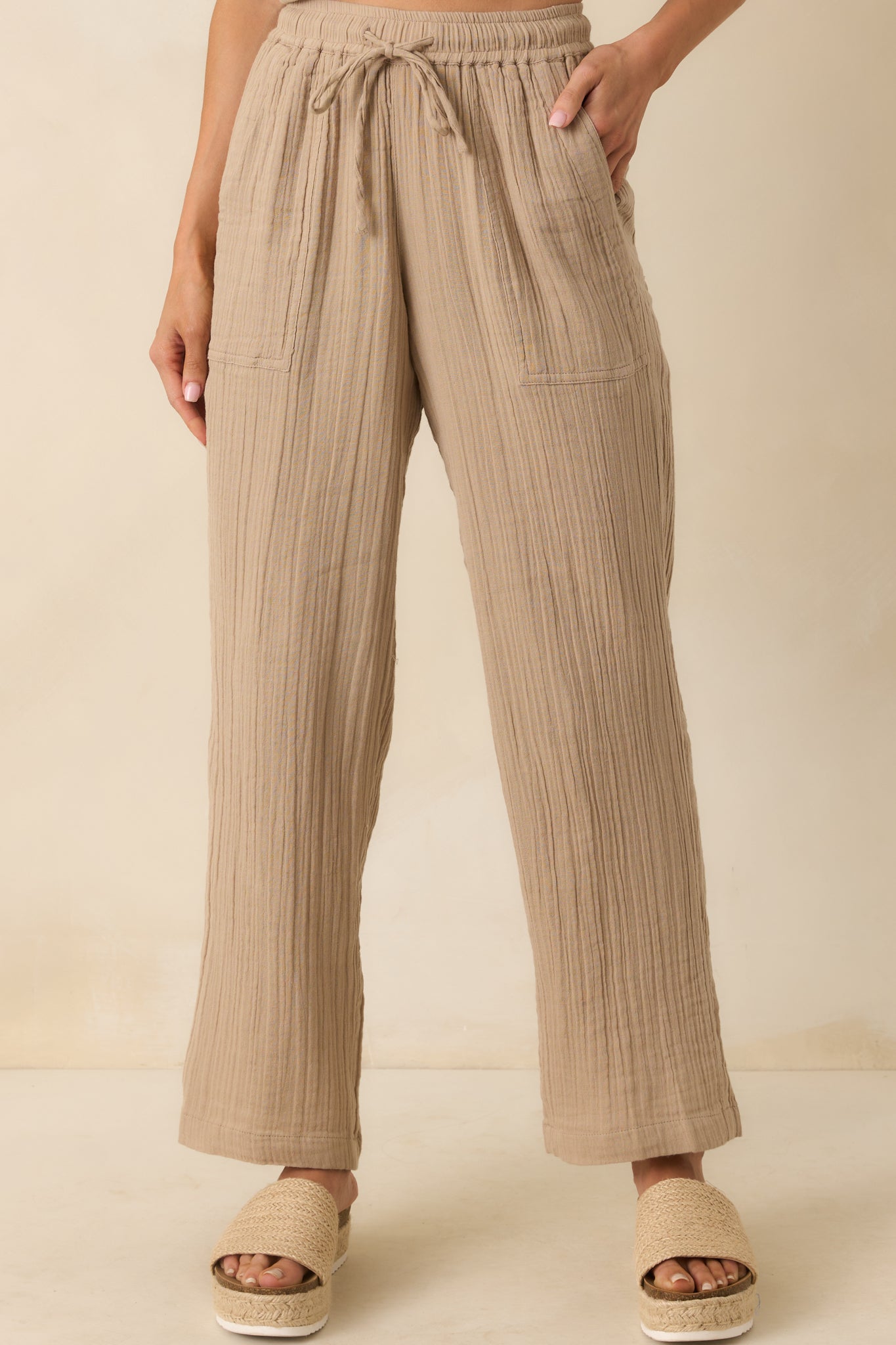 A lower leg view displaying the ankle length hem and subtle structure of the full length lining.