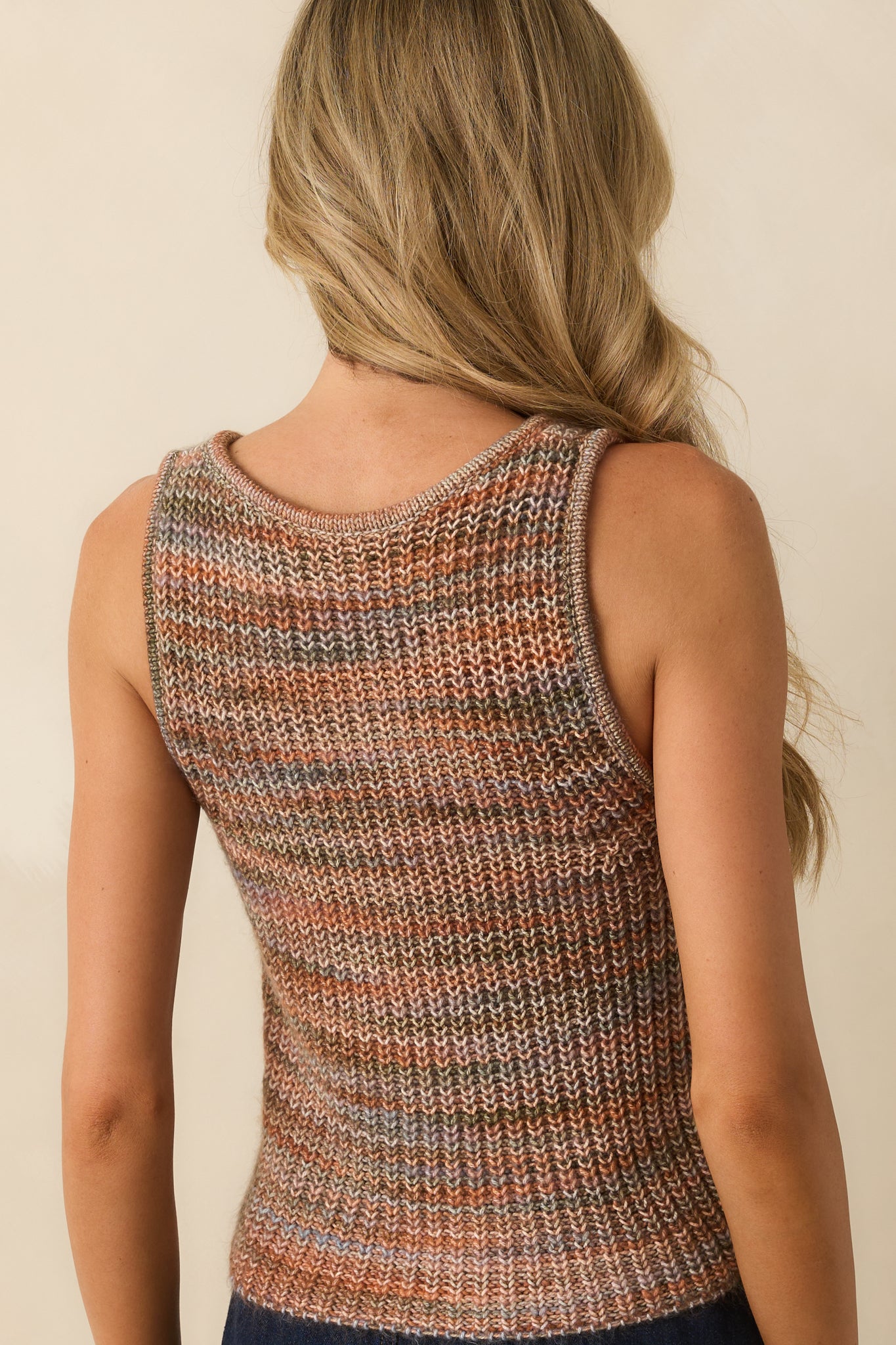 Rear of the terracotta tank highlighting the relaxed fit and airy knit design.