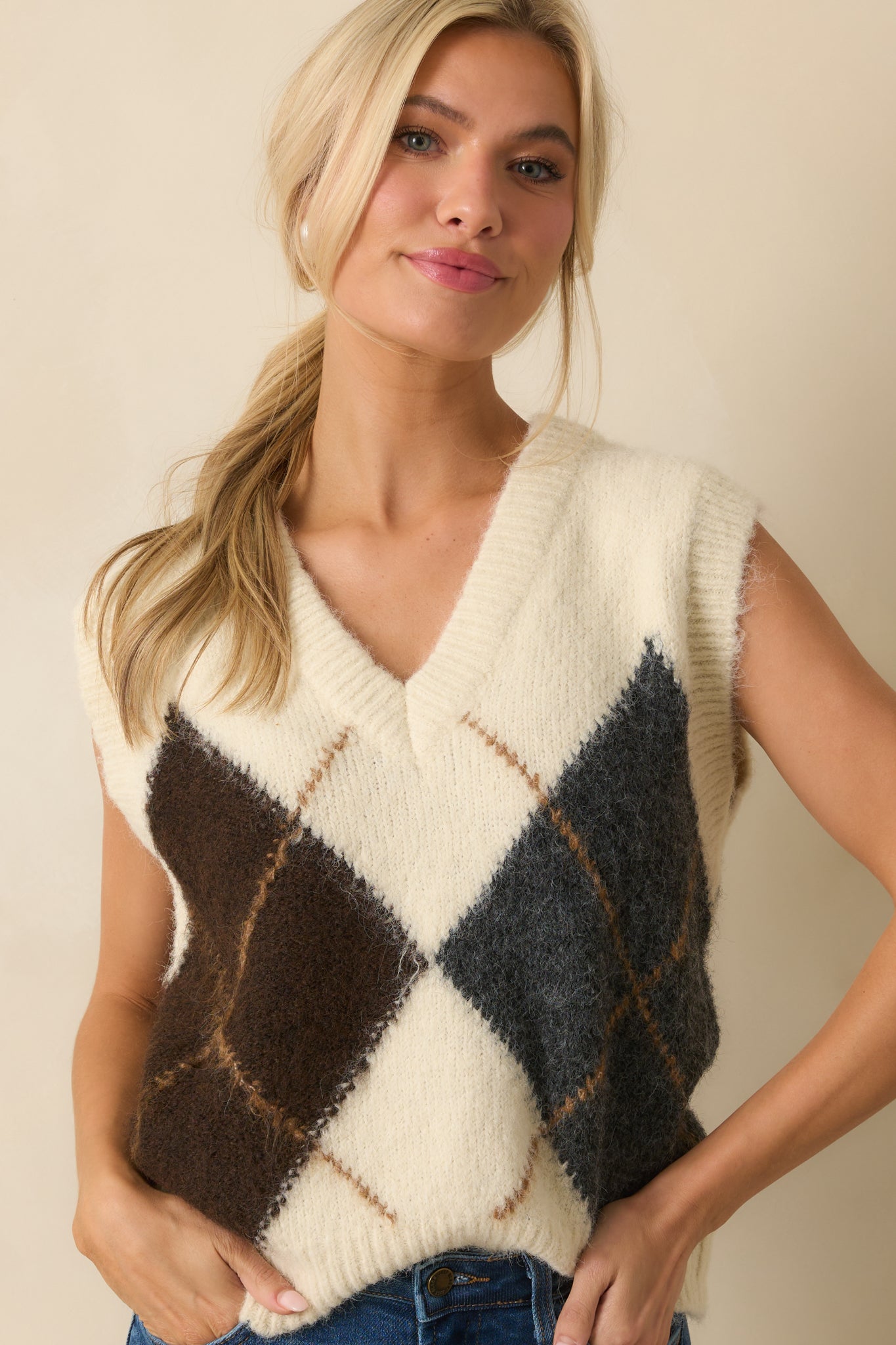 Textured lightweight knit fabric and bold argyle pattern shown up close.