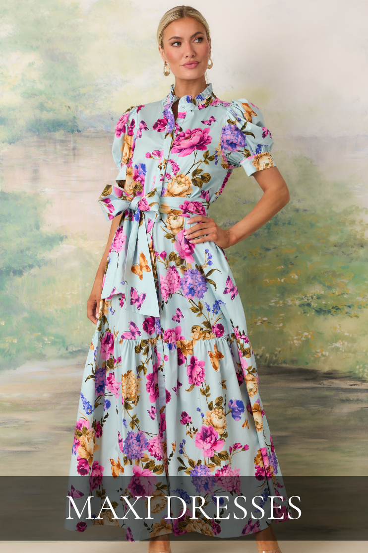 Model wearing a light blue floral puff sleeve maxi dress with a belted waist, showcasing trendy and timeless women’s maxi dresses with feminine spring styling.