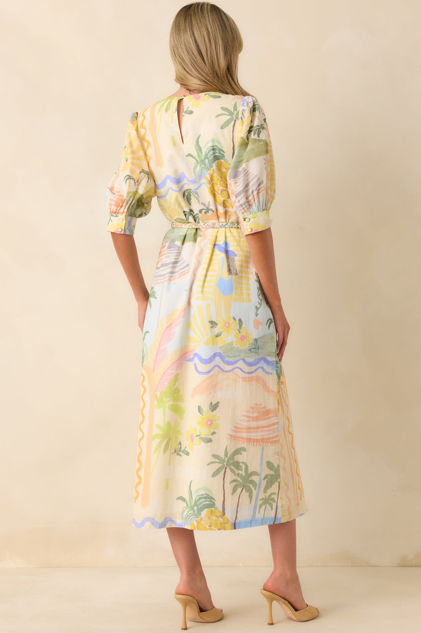 Back view of Prosperina tropical print midi featuring a back keyhole button closure.