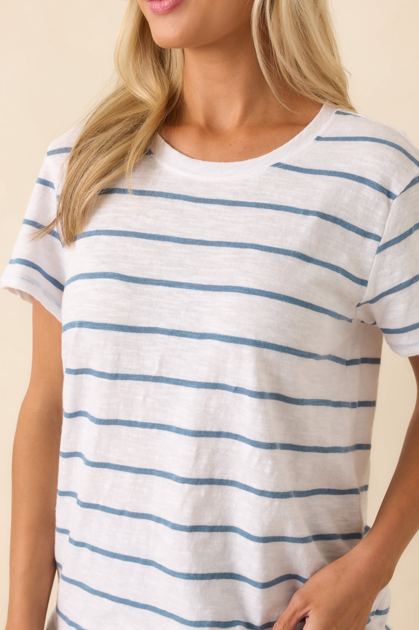 Close-up of the blue stripe pattern and brushed slub jersey texture, showing the softness and detail of the fabric.