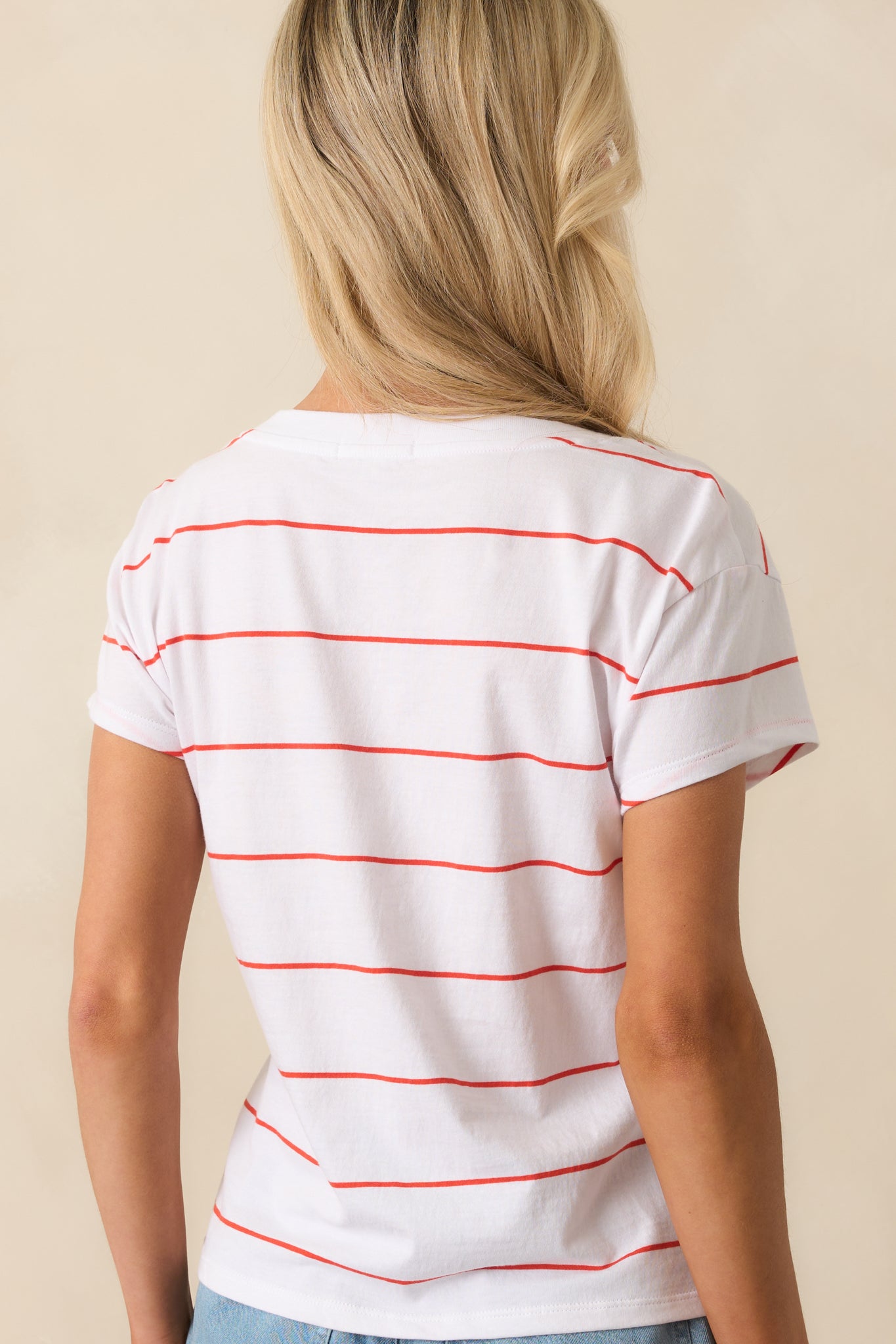 A view from behind displaying the full stripe pattern, short sleeves, and relaxed fit across the back of the tee.