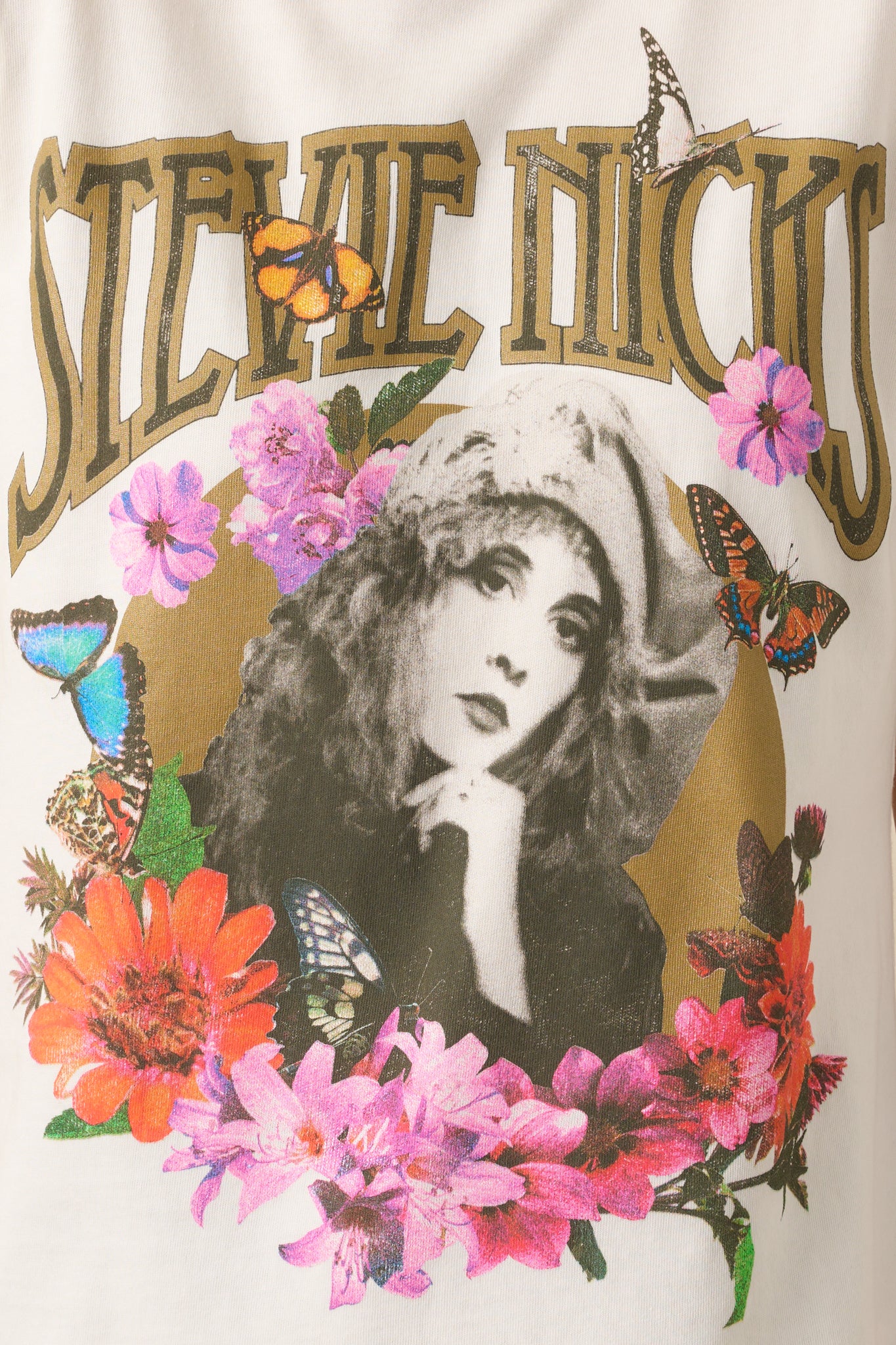 Close-up detail of the metallic ink within the floral collage framing Stevie Nicks’s portrait.