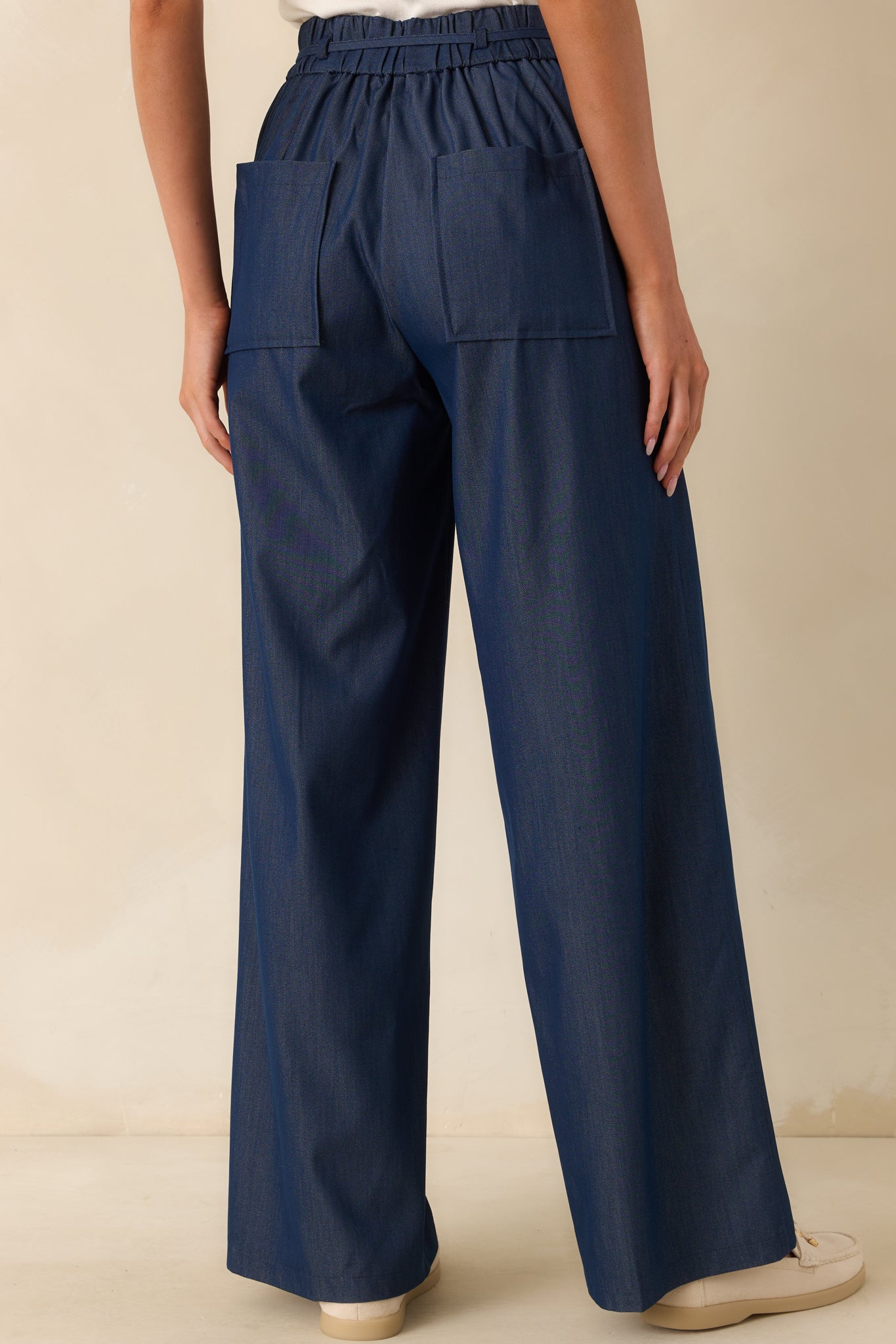 A view from behind showing the high rise waist, back pockets, and the elastic insert at the waistband.
