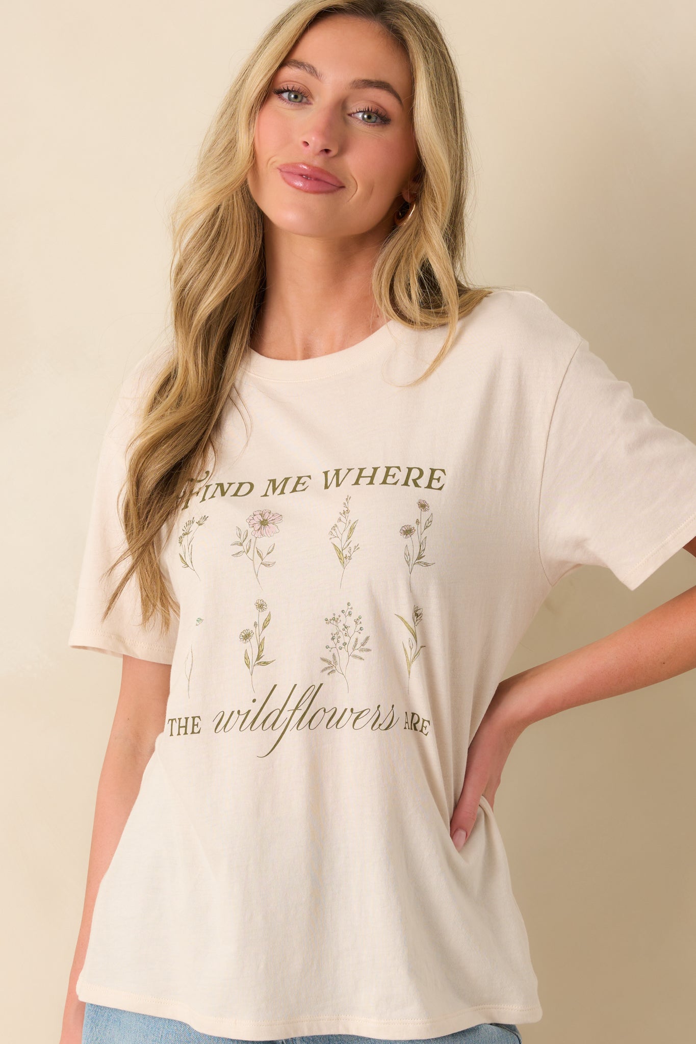 Cropped shot highlighting one of the short sleeves and the casual drop of the shoulder seam.