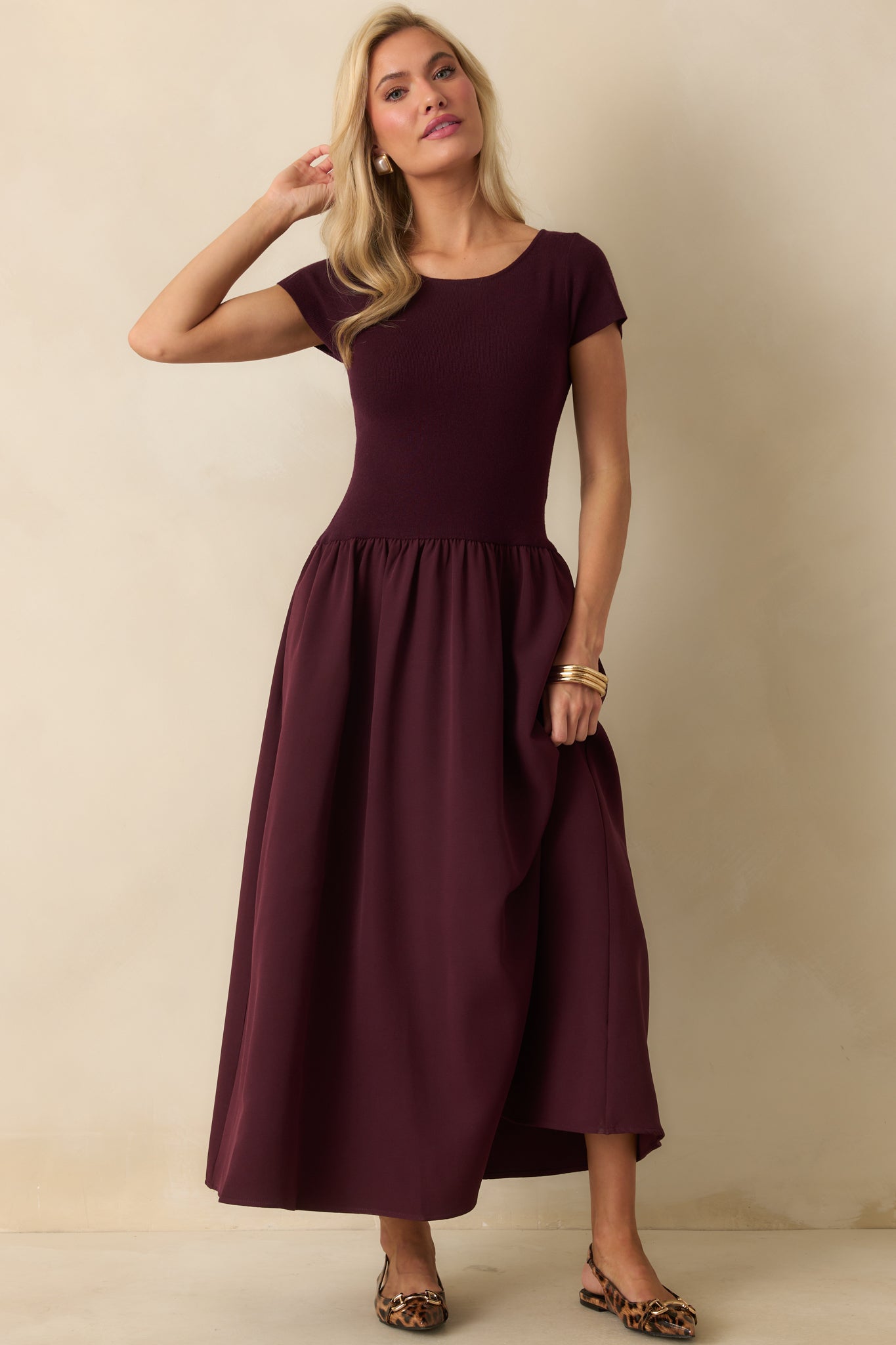 Wine red maxi dress with a soft ribbed top, gathered skirt detail, and effortless drape.