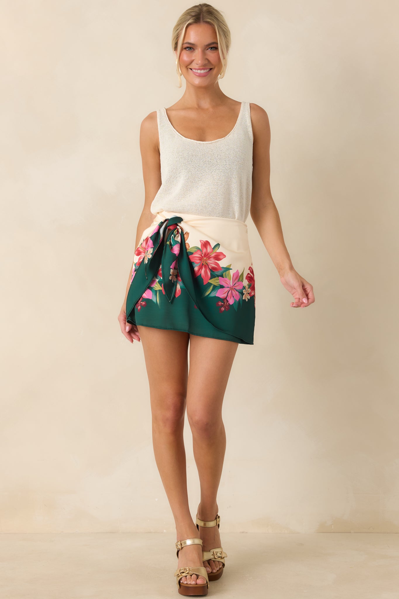 Ivory sleeveless tank top with a relaxed shape, scoop neckline, and textured knit fabric for a comfortable feel.