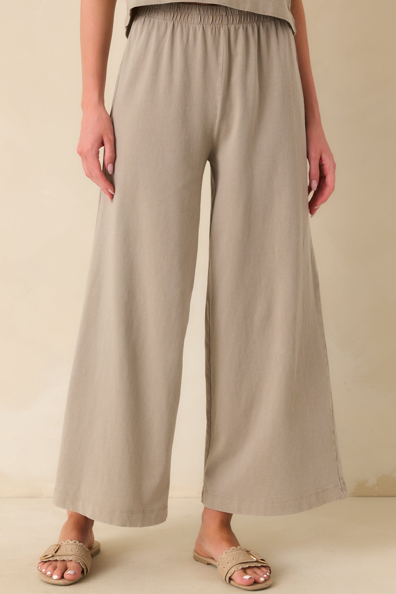 A cropped front view focusing on the high waisted rise and gathered detailing at the elastic waistband.