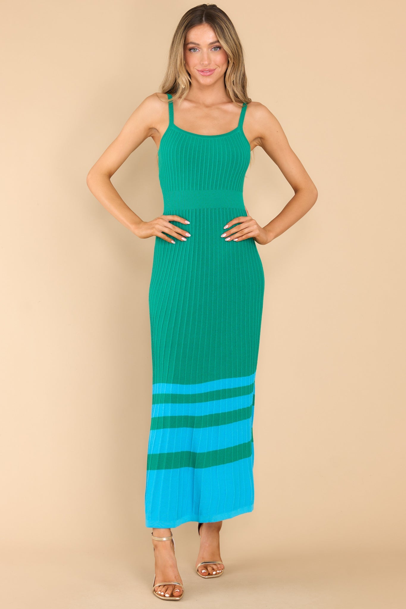 Front view of this dress that features a scoop neckline, non-adjustable straps, a ribbed texture, and stretch throughout.