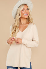 Front view of this sweater that features a v-neckline and long sleeves.
