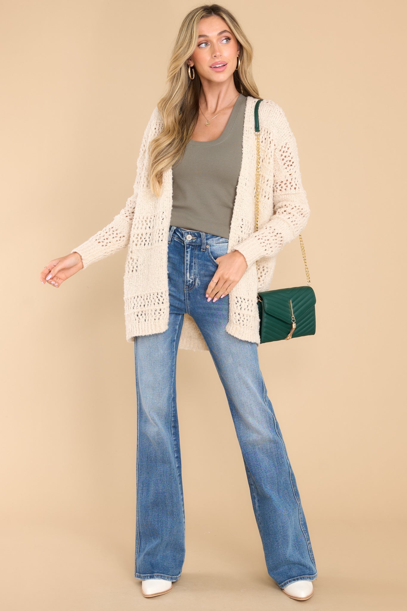 Front view of this cardigan that features a textured design, ribbed detailing, and a soft fabric.