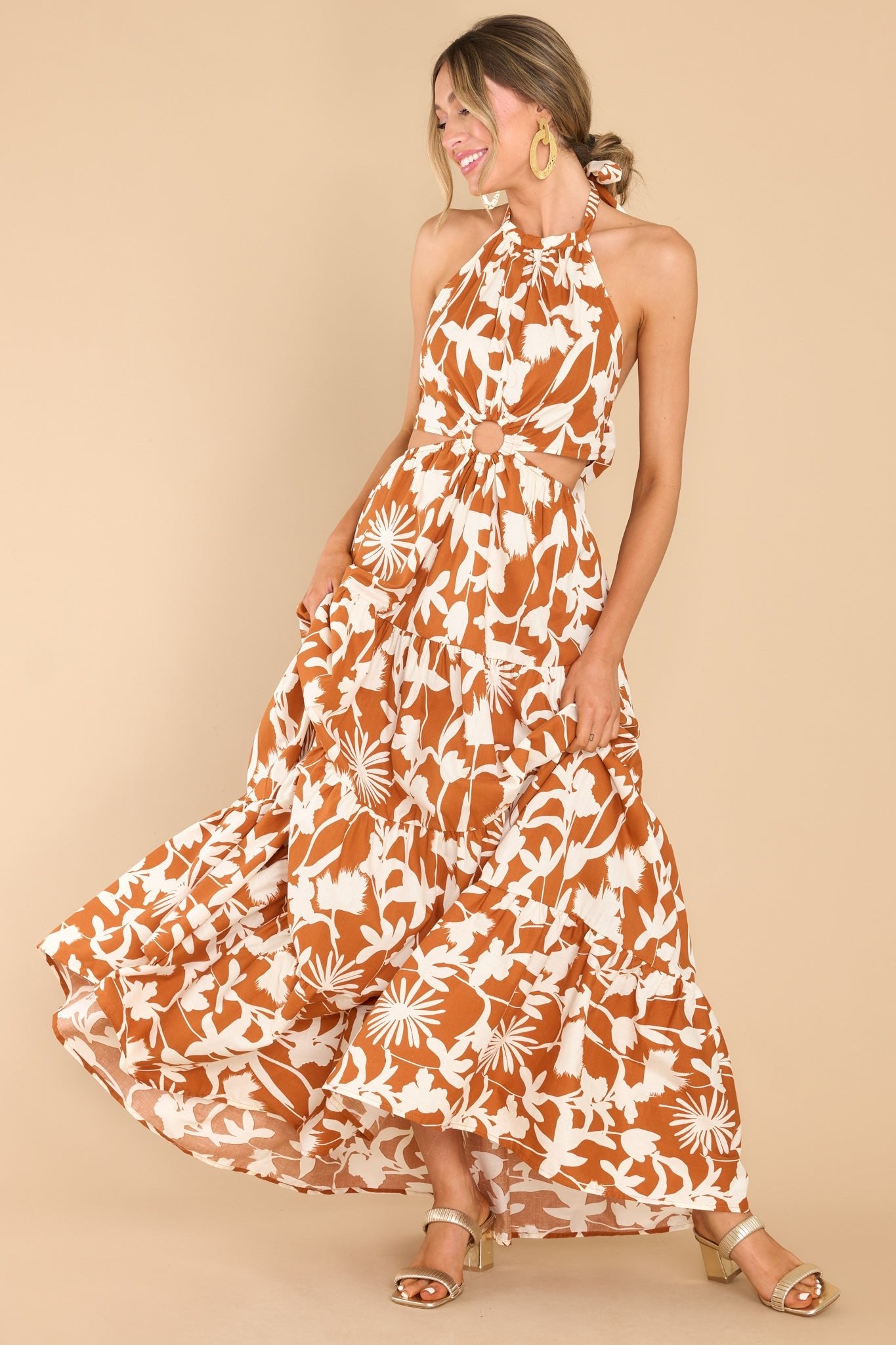 Full body view of this dress that features the ivory pattern of the brown fabric.