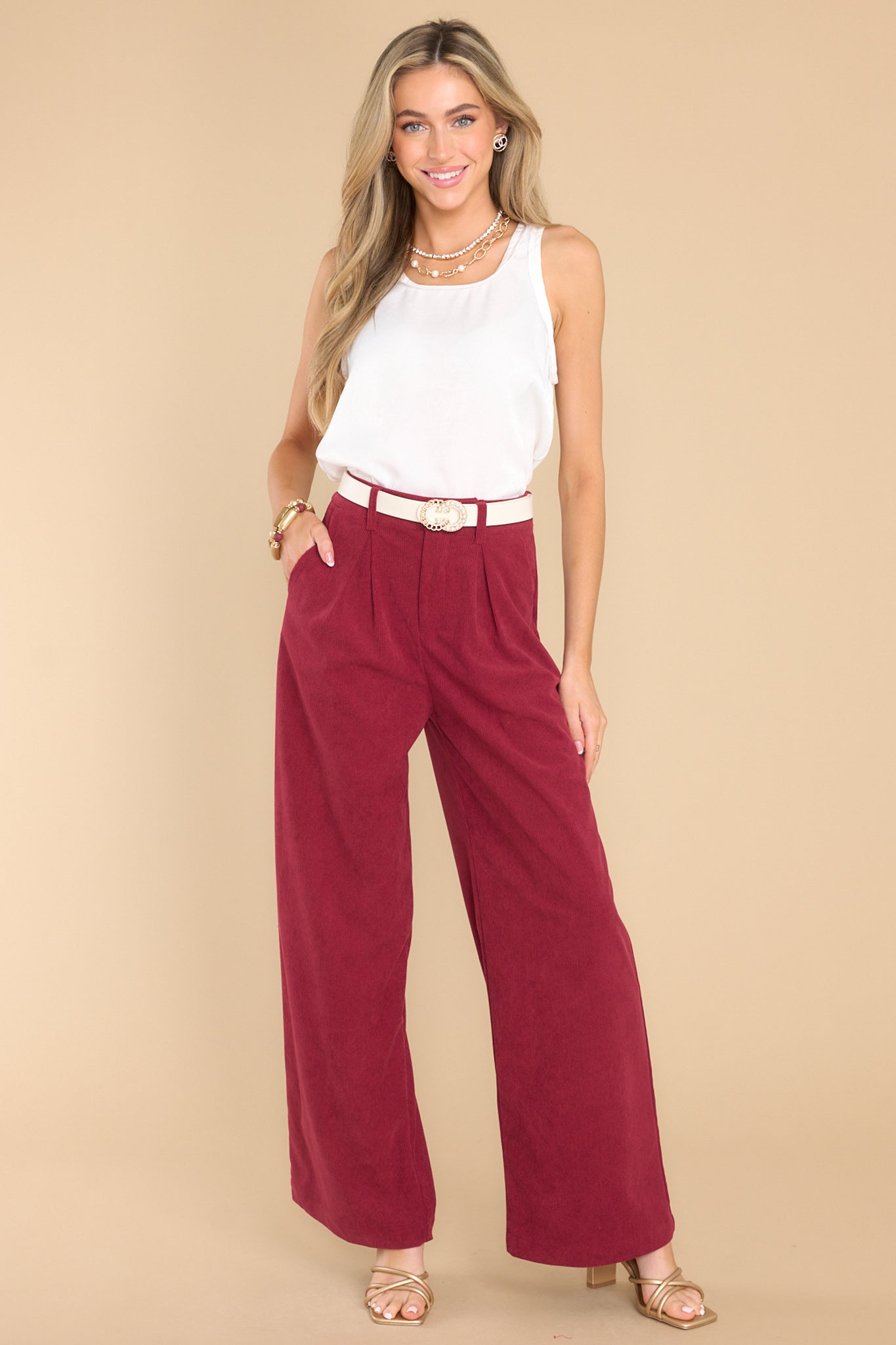 Full body view of these pants that feature a corduroy like material with a zipper hook and eye closure, and two front functional pockets.