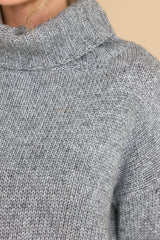 Close up view of this sweater that features a high chunky turtle neck and a super soft fabric. 
