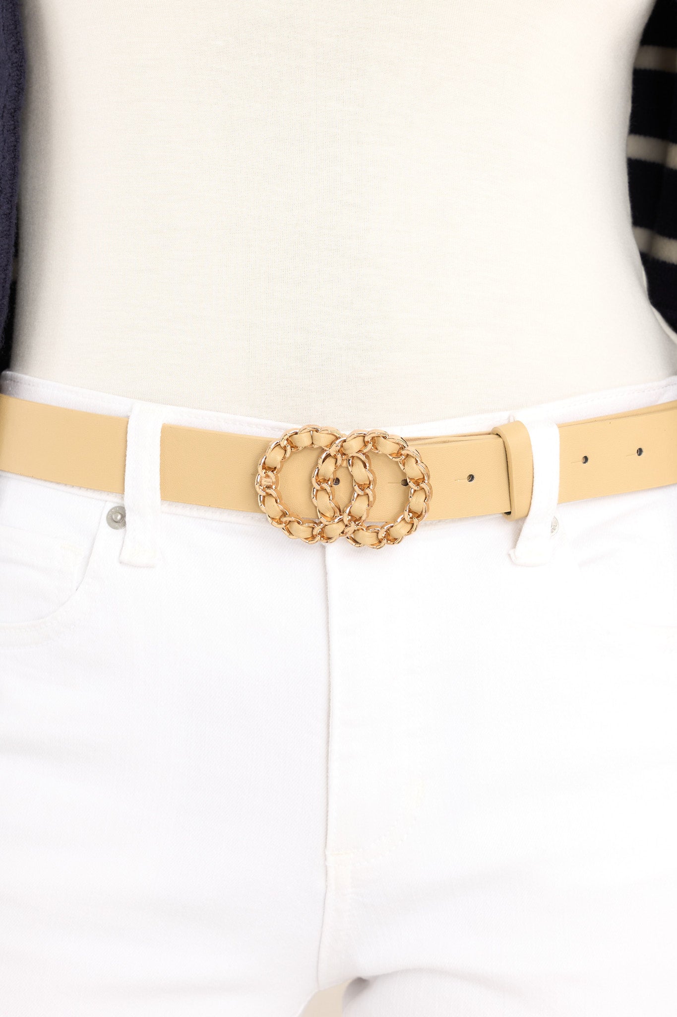 This beige belt features gold hardware, and a double hoop buckle closure.