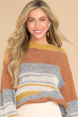 Front view of this sweater that features a crew neckline, ribbed cuffs, and an oversized fit.