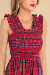 Close up view of this dress that features thick ruffle straps and a smocked bodice.