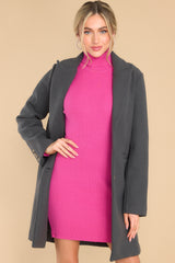 Front view of this coat that features a collared neckline and two functional buttons down the front.
