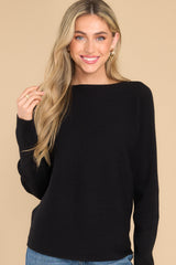 Front view of  this sweater that features a round neckline.