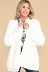 Front view of this cardigan that features two functional pockets on the front.