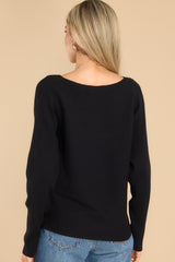 Back view of  this sweater that features a round neckline and a soft stretchy material.