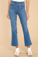 Front view of these jeans that feature a high rise design, belt loops, a slip-on style (with no zipper or button closures), non-functional front pockets, functional back pockets, and a cropped length.