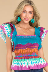 Front view of this top that showcases the vibrant pattern of the fabric.