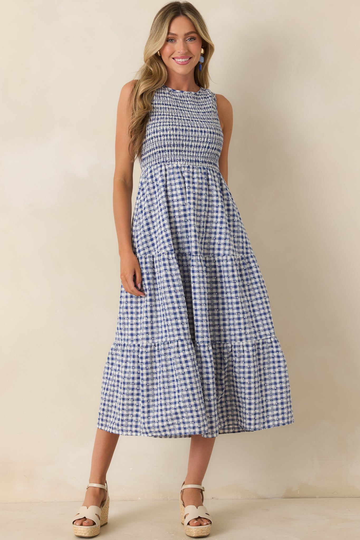 Cotton midi dress with eyelet embroidery throughout and a lightweight breathable structure.