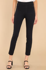 These all black pants feature a seamless front, two decorative front pockets, two decorative back pockets, a natural waist, fitted hips, and skinny ankle length legs.