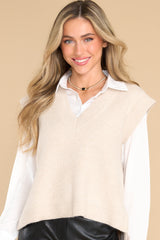 Front view ofthis vest that features a v-neckline, side slits, and a knit texture throughout.