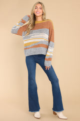 Full body view of this sweater that features an oversized fit.