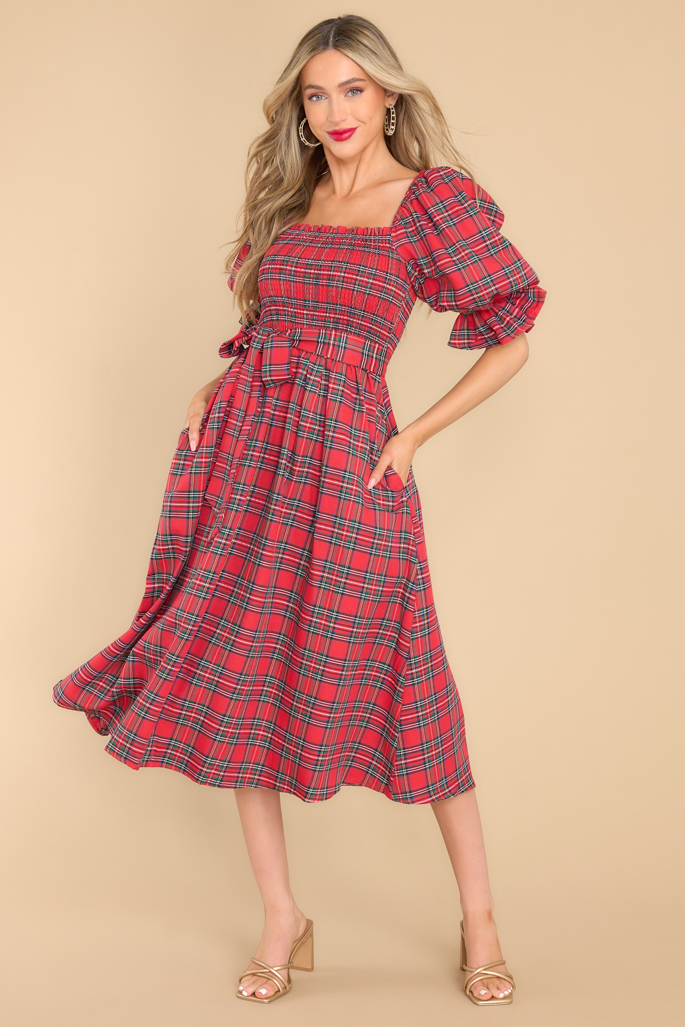 red plaid midi dress with a smocked bust and puffed sleeves.