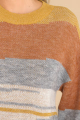 Close up view of this sweater that features a crew neckline.
