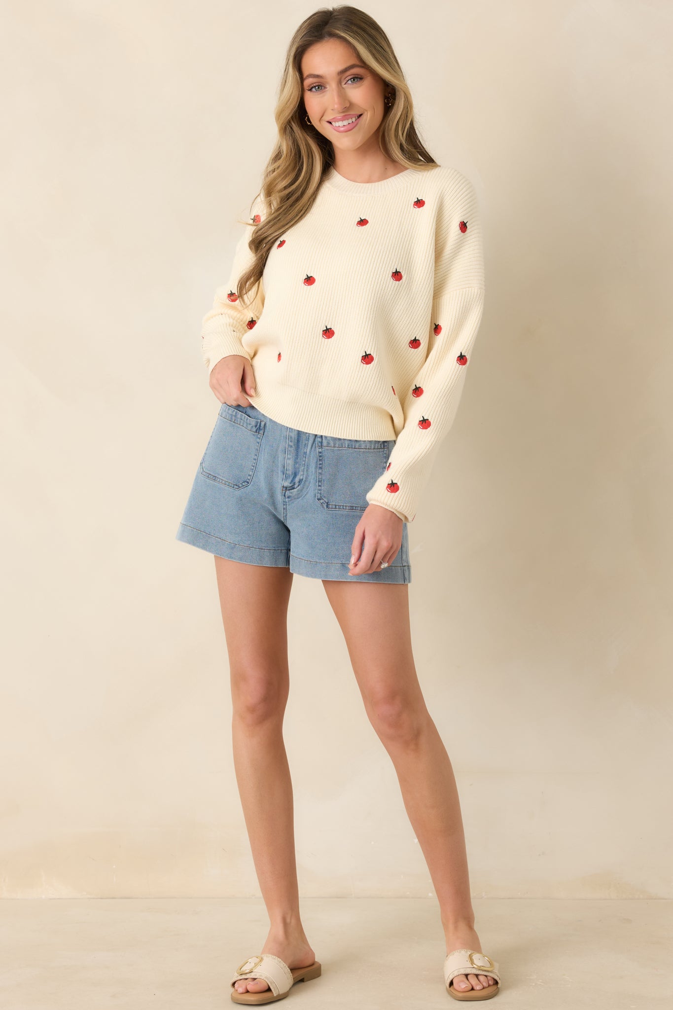 Relaxed-fit ivory sweater with embroidered tomato pattern throughout and subtle ribbed detailing.