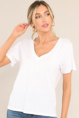 Front view of this top that features a v-neckline, short sleeves, and a lightweight fabric.