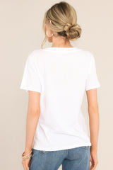 Back view of this top that features a v-neckline, short sleeves, and a lightweight fabric.