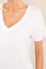 Close up view of this top that features a v-neckline, short sleeves, and a lightweight fabric.