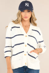 Front view of this cardigan that features a functional button front, functional pockets, ribbed cuffed long sleeves, and a ribbed hemline.