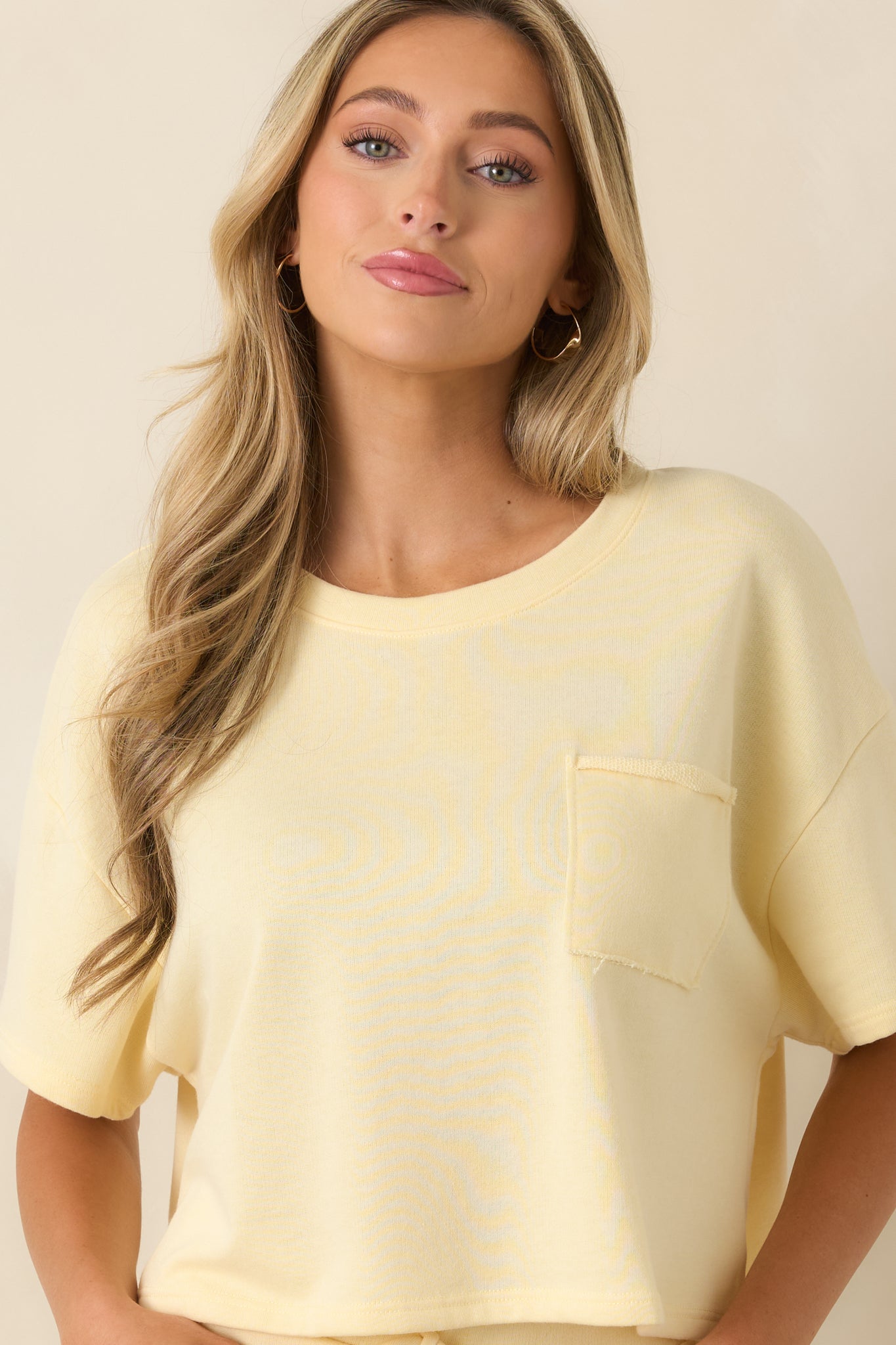 Close cropped view of the front pocket detail and smooth cotton-poly knit construction.