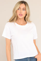 Back view of this tee that features a ribbed crew neckline, a relaxed fit, and short sleeves.