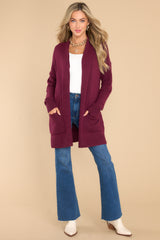  This plum colored cardigan features front pockets, an oversized cozy fit, and soft knit fabric.