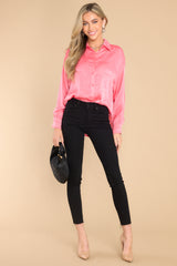 This pink top features a collared neckline, buttons down the front, buttons at the cuff, and a classic relaxed fit.
