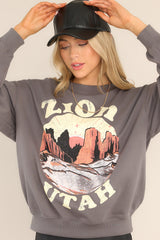 Front view of this sweatshirt that features a ribbed crew neckline, dropped shoulders, a Zion graphic, ribbed cuffed long sleeves, and a ribbed hemline.