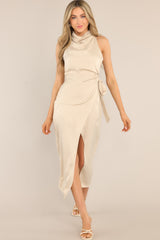 Front view of this dress that features a high cowl neckline, a zipper down the back, a wrap-like design with a self-tie feature at the waist, and a front slit.