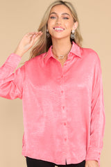 Front view of this top that features a collared neckline, buttons down the front, buttons at the cuff, and a classic relaxed fit.