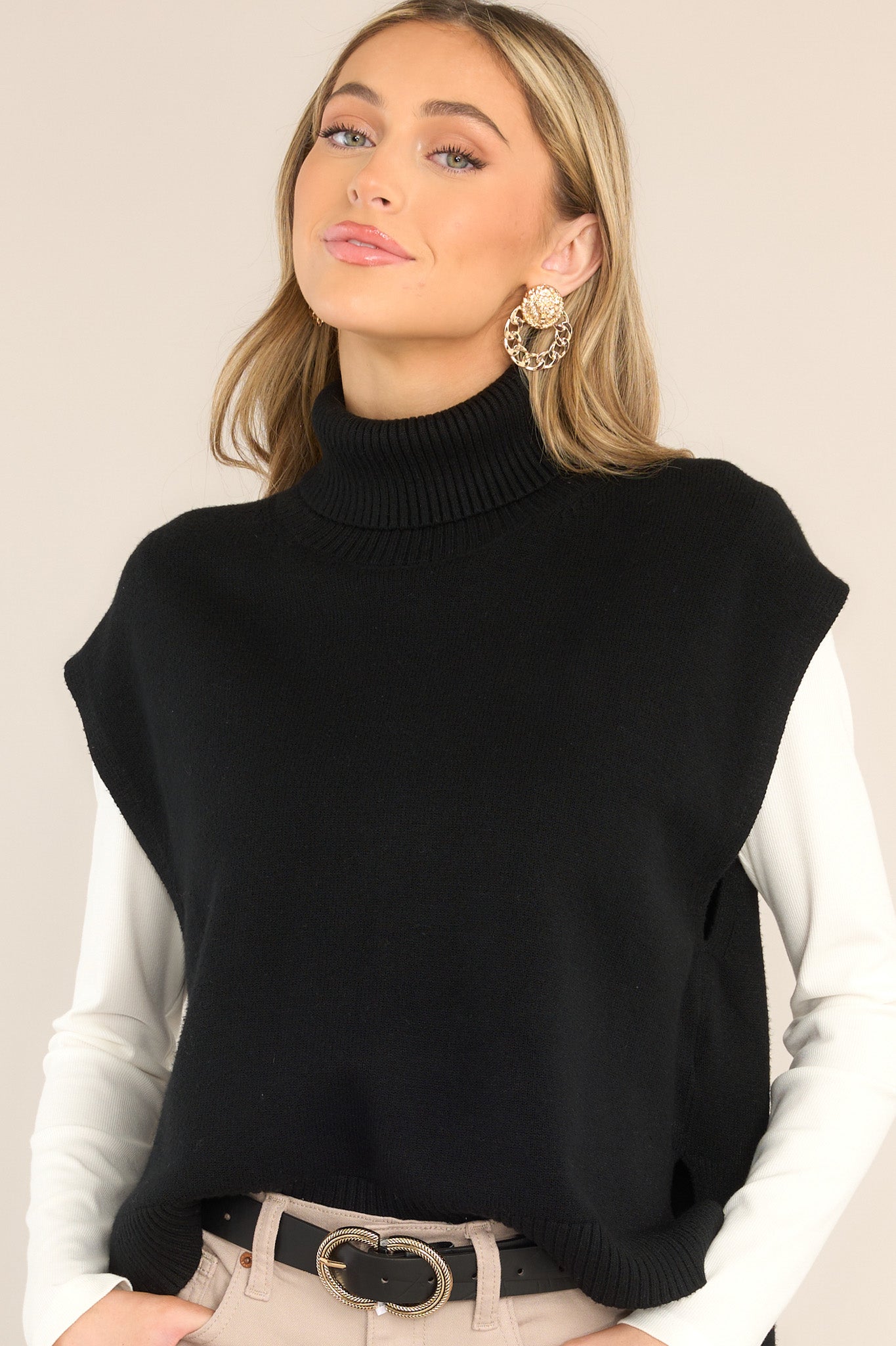 Front view of  this sweater vest that features a relaxed-fit, turtleneck sweater vest in soft, rib-knit fabric with wool content.