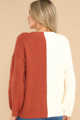 Back view of this sweater that features a v-neckline, ribbed detailing throughout, and a two tone color blocking.