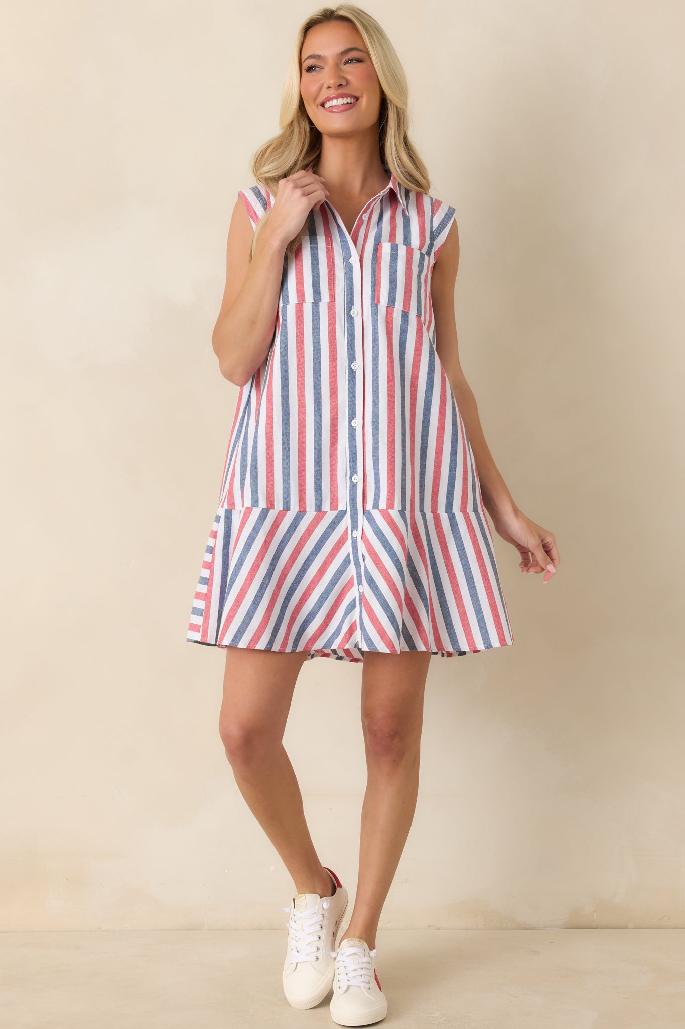 Lightweight cotton mini dress featuring mixed stripe patterns, front chest pockets, and side pockets.