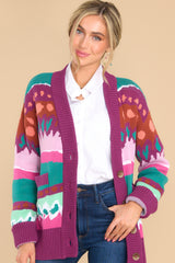 Front view of this cardigan that features the multi-colored prints of the fabric.